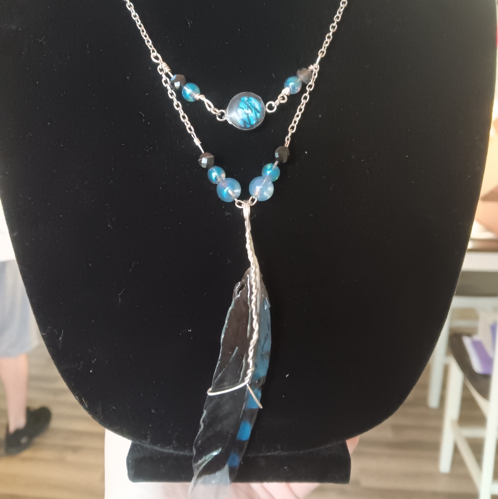 Elegant Silver And Blue Feather Necklace